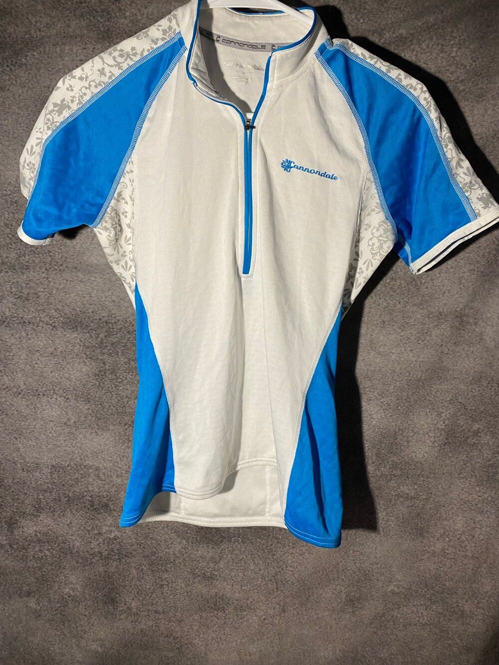 Cannondale Women Small Cycling Jersey Blue White Floral 1/4 Zip 3 Pocket